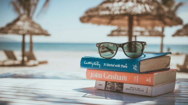 black-framed-ray-ban-wayfarer-sunglasses-on-top-of-book.jpg black framed Ray-Ban Wayfarer sunglasses on top of book